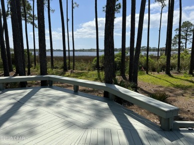 This wooded lot with lots of natural land behind the lot. View on Sharks Tooth Golf Club in Florida - for sale on GolfHomes.com, golf home, golf lot