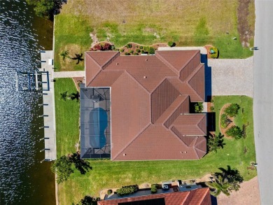 Punta Gorda Isles! Experience luxury living at its finest in on Saint Andrews South Golf Club in Florida - for sale on GolfHomes.com, golf home, golf lot
