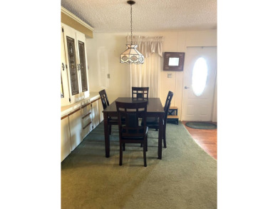 This 2-bedroom, 2-bathroom home offers a perfect place for on Lake Henry Golf Club in Florida - for sale on GolfHomes.com, golf home, golf lot