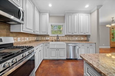 Custom home nestled on a 2.5-acre lot surrounded by a lush on Bay Springs Country Club in Mississippi - for sale on GolfHomes.com, golf home, golf lot