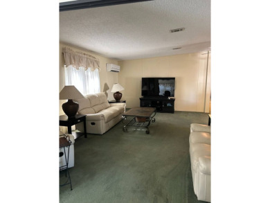 This 2-bedroom, 2-bathroom home offers a perfect place for on Lake Henry Golf Club in Florida - for sale on GolfHomes.com, golf home, golf lot