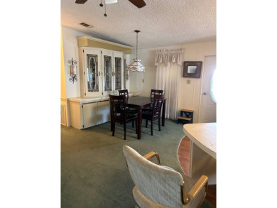 This 2-bedroom, 2-bathroom home offers a perfect place for on Lake Henry Golf Club in Florida - for sale on GolfHomes.com, golf home, golf lot
