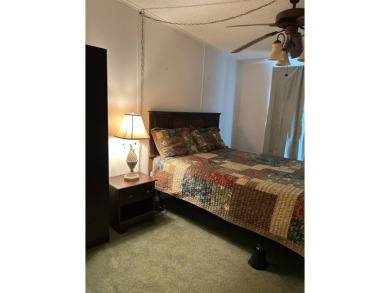 This 2-bedroom, 2-bathroom home offers a perfect place for on Lake Henry Golf Club in Florida - for sale on GolfHomes.com, golf home, golf lot