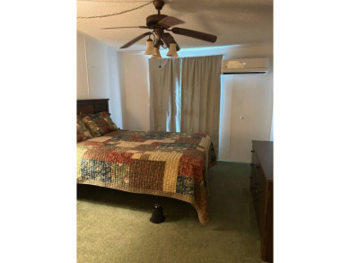 This 2-bedroom, 2-bathroom home offers a perfect place for on Lake Henry Golf Club in Florida - for sale on GolfHomes.com, golf home, golf lot