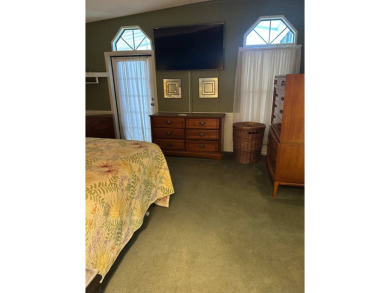 This 2-bedroom, 2-bathroom home offers a perfect place for on Lake Henry Golf Club in Florida - for sale on GolfHomes.com, golf home, golf lot
