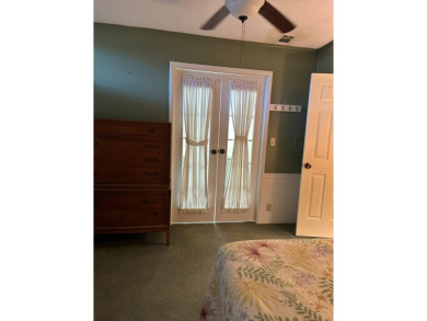 This 2-bedroom, 2-bathroom home offers a perfect place for on Lake Henry Golf Club in Florida - for sale on GolfHomes.com, golf home, golf lot