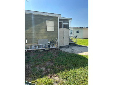 This 2-bedroom, 2-bathroom home offers a perfect place for on Lake Henry Golf Club in Florida - for sale on GolfHomes.com, golf home, golf lot