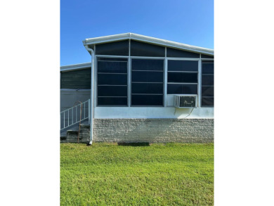 This 2-bedroom, 2-bathroom home offers a perfect place for on Lake Henry Golf Club in Florida - for sale on GolfHomes.com, golf home, golf lot