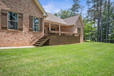 Custom home nestled on a 2.5-acre lot surrounded by a lush on Bay Springs Country Club in Mississippi - for sale on GolfHomes.com, golf home, golf lot