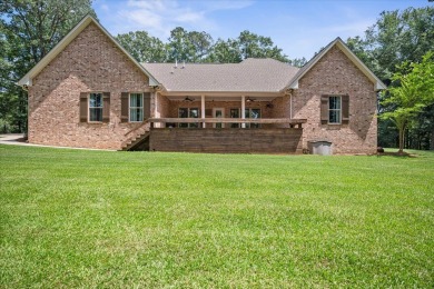 Custom home nestled on a 2.5-acre lot surrounded by a lush on Bay Springs Country Club in Mississippi - for sale on GolfHomes.com, golf home, golf lot
