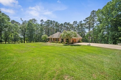 Custom home nestled on a 2.5-acre lot surrounded by a lush on Bay Springs Country Club in Mississippi - for sale on GolfHomes.com, golf home, golf lot