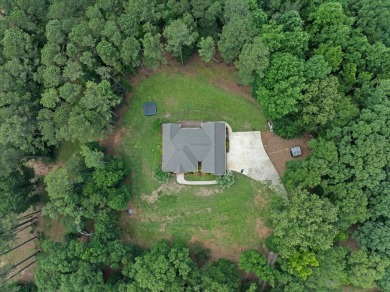 Custom home nestled on a 2.5-acre lot surrounded by a lush on Bay Springs Country Club in Mississippi - for sale on GolfHomes.com, golf home, golf lot