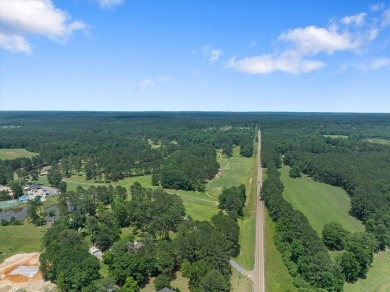 Custom home nestled on a 2.5-acre lot surrounded by a lush on Bay Springs Country Club in Mississippi - for sale on GolfHomes.com, golf home, golf lot