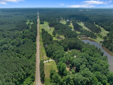 Custom home nestled on a 2.5-acre lot surrounded by a lush on Bay Springs Country Club in Mississippi - for sale on GolfHomes.com, golf home, golf lot
