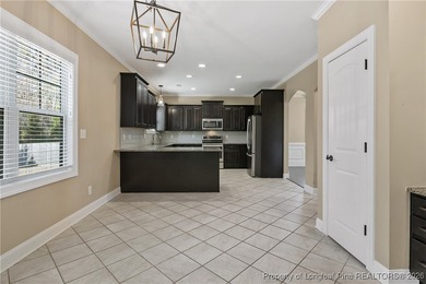 GATES FOUR - Guarded/Gated/Golf Community. Two Story Stone & on Gates Four Golf and Country Club in North Carolina - for sale on GolfHomes.com, golf home, golf lot