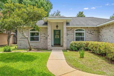 Blooming Crepe Myrtles greet you out front of this beautifully on Tiger Point Golf and Country Club in Florida - for sale on GolfHomes.com, golf home, golf lot