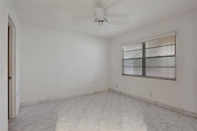 JUST PAINTED & WALLPAPER REMOVED! SALE OF THE CENTURY IN VIBRANT on Wynmoor Golf Course in Florida - for sale on GolfHomes.com, golf home, golf lot