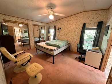 This home has a 1 yr old roof and AC unit!! Water heater only 4 on Whisperwood Golf Course in Florida - for sale on GolfHomes.com, golf home, golf lot