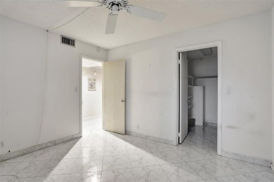 JUST PAINTED & WALLPAPER REMOVED! SALE OF THE CENTURY IN VIBRANT on Wynmoor Golf Course in Florida - for sale on GolfHomes.com, golf home, golf lot