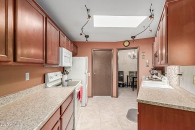 This well-cared-for 2-bedroom, 1.75-bath townhome is move-in on Sun City Lakes West and East in Arizona - for sale on GolfHomes.com, golf home, golf lot