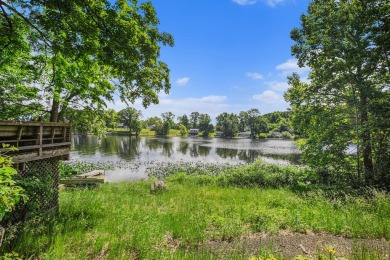 Geneva Lake frontage! This over 1.5 wooded acres property has on Orchard Hills Golf Course in Michigan - for sale on GolfHomes.com, golf home, golf lot