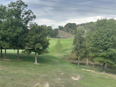 Walk-In Golf front condo with a pond view located  at on Ledgestone Country Club and Golf Course in Missouri - for sale on GolfHomes.com, golf home, golf lot