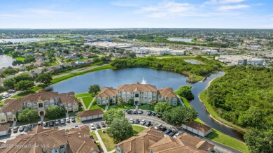 Your Lakeside Escape in the Heart of Viera This 2 bed, 2 bath on Indian River Colony Club in Florida - for sale on GolfHomes.com, golf home, golf lot