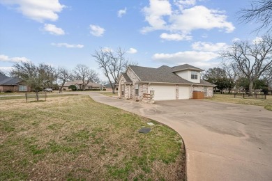 This beautiful  IMMACULATE home is located on the corner of a on Pecan Plantation Country Club in Texas - for sale on GolfHomes.com, golf home, golf lot