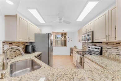 This beautifully renovated apartment seamlessly blends modern on Sunrise Lakes Phase IV Golf Course in Florida - for sale on GolfHomes.com, golf home, golf lot