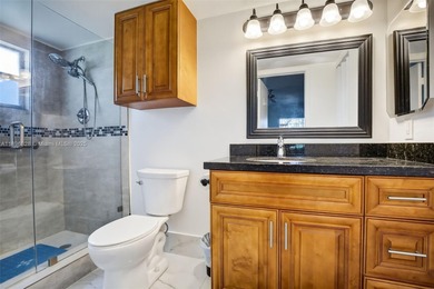 Enjoy serene lake and golf course views from this first-floor on Flamingo Lakes Country Club in Florida - for sale on GolfHomes.com, golf home, golf lot