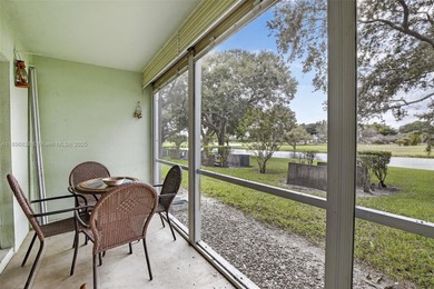 Enjoy serene lake and golf course views from this first-floor on Flamingo Lakes Country Club in Florida - for sale on GolfHomes.com, golf home, golf lot