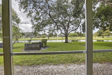 Enjoy serene lake and golf course views from this first-floor on Flamingo Lakes Country Club in Florida - for sale on GolfHomes.com, golf home, golf lot
