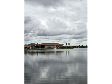 Enjoy serene lake and golf course views from this first-floor on Flamingo Lakes Country Club in Florida - for sale on GolfHomes.com, golf home, golf lot