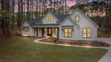 EXPERIENCE THE PERFECT BLEND OF LUXURY AND COMFORT IN THIS on Harbor Club Golf and Country Club in Georgia - for sale on GolfHomes.com, golf home, golf lot