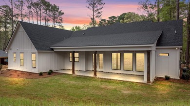 EXPERIENCE THE PERFECT BLEND OF LUXURY AND COMFORT IN THIS on Harbor Club Golf and Country Club in Georgia - for sale on GolfHomes.com, golf home, golf lot