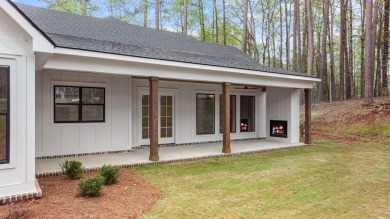 EXPERIENCE THE PERFECT BLEND OF LUXURY AND COMFORT IN THIS on Harbor Club Golf and Country Club in Georgia - for sale on GolfHomes.com, golf home, golf lot