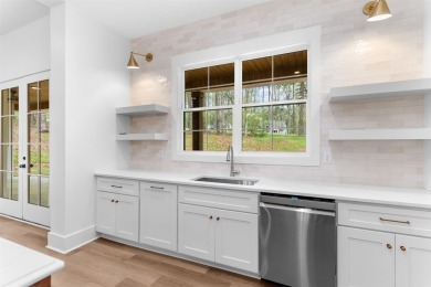 EXPERIENCE THE PERFECT BLEND OF LUXURY AND COMFORT IN THIS on Harbor Club Golf and Country Club in Georgia - for sale on GolfHomes.com, golf home, golf lot