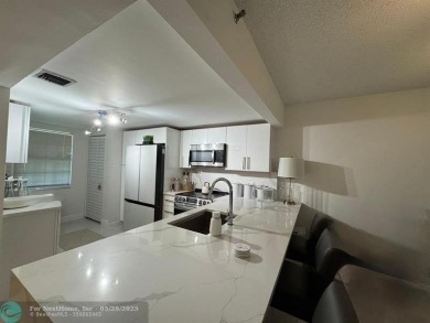 Stunningly remodeled 2/2 condo located in The Oaks at Palm Aire on Palm-Aire Country Club and Resort - The Oaks in Florida - for sale on GolfHomes.com, golf home, golf lot