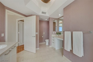 A stunning corner residence with floor-to-ceiling windows on Las Vegas Country Club in Nevada - for sale on GolfHomes.com, golf home, golf lot