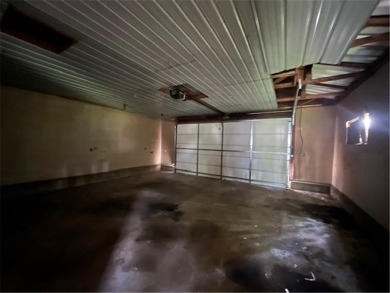 In the heart of town, this 2 story is nestled in between mature on The Amery Golf Club in Wisconsin - for sale on GolfHomes.com, golf home, golf lot