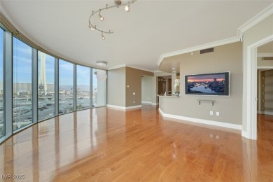 A stunning corner residence with floor-to-ceiling windows on Las Vegas Country Club in Nevada - for sale on GolfHomes.com, golf home, golf lot