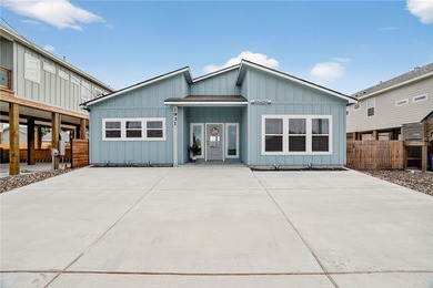 Skip the stairs and step into this modern coastal sanctuary! on Palmilla Beach Golf Club in Texas - for sale on GolfHomes.com, golf home, golf lot