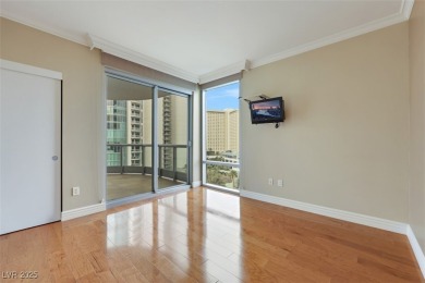 A stunning corner residence with floor-to-ceiling windows on Las Vegas Country Club in Nevada - for sale on GolfHomes.com, golf home, golf lot