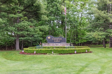 This spacious 3-bedroom, 2-bath ranch offers over 2,000 square on Canadian Lakes Country Club-The Royal Course in Michigan - for sale on GolfHomes.com, golf home, golf lot