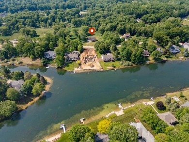 This spacious 3-bedroom, 2-bath ranch offers over 2,000 square on Canadian Lakes Country Club-The Royal Course in Michigan - for sale on GolfHomes.com, golf home, golf lot
