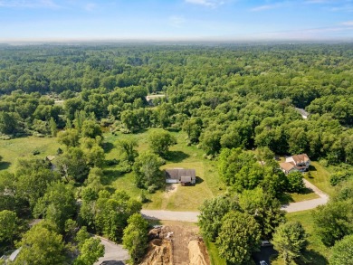 This spacious 3-bedroom, 2-bath ranch offers over 2,000 square on Canadian Lakes Country Club-The Royal Course in Michigan - for sale on GolfHomes.com, golf home, golf lot