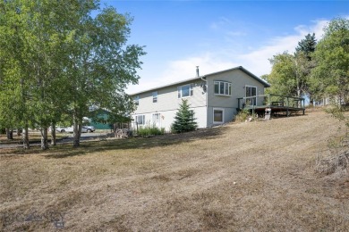 This spacious home, nestled near Deer Park Golf Course and the on Deer Park Golf Club in Montana - for sale on GolfHomes.com, golf home, golf lot