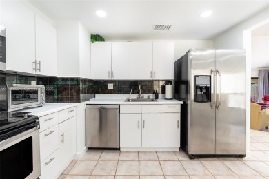 Welcome to this beautifully updated 3 bed, 2 bath condo villa on Grande Oaks Golf Club in Florida - for sale on GolfHomes.com, golf home, golf lot