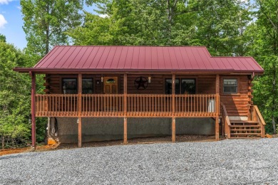 Welcome to your dream cabin nestled in the highly sought-after on Rumbling Bald Resort on Lake Lure in North Carolina - for sale on GolfHomes.com, golf home, golf lot