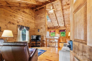 Welcome to your dream cabin nestled in the highly sought-after on Rumbling Bald Resort on Lake Lure in North Carolina - for sale on GolfHomes.com, golf home, golf lot